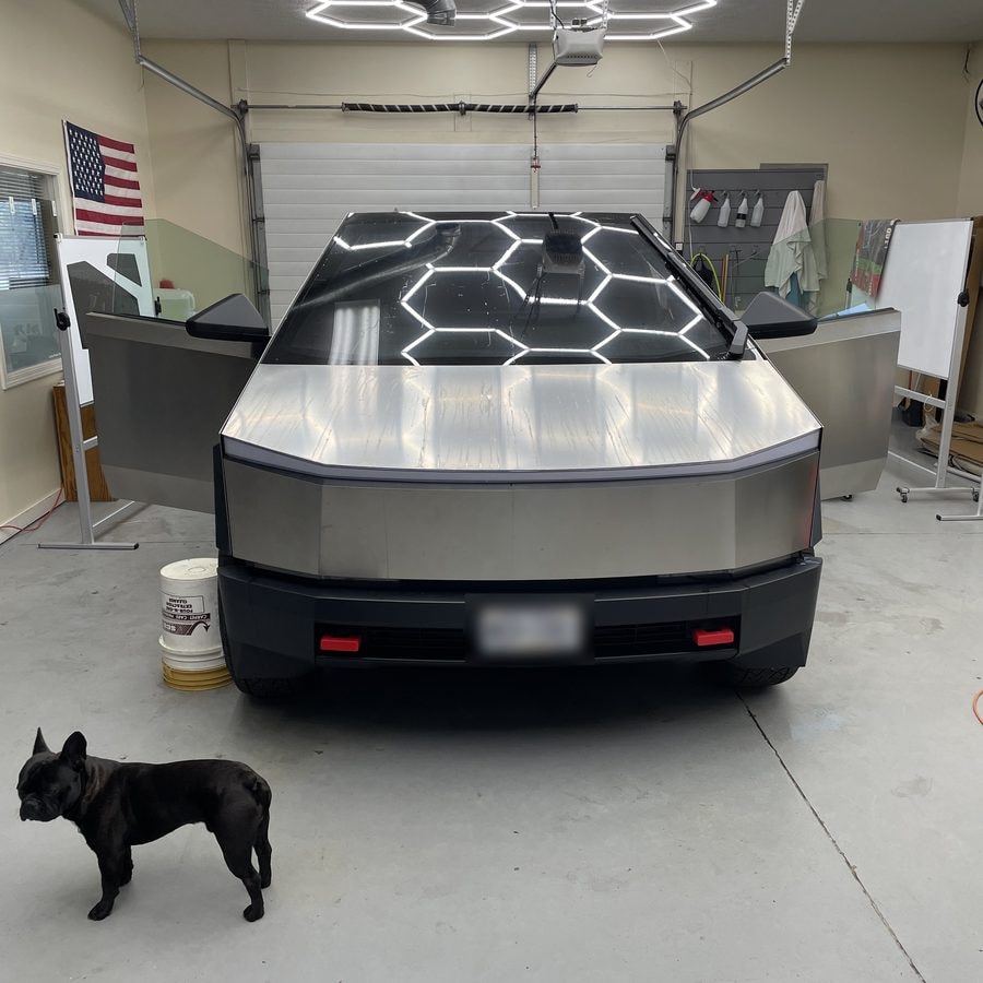 Tesla Cybertruck with tinted windows inside the Lindsay Window Tinting shop in Rochester, NY