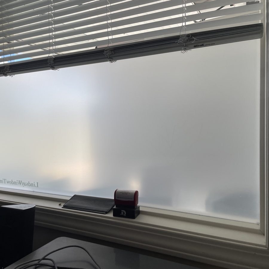 Frosted privacy film on an office window