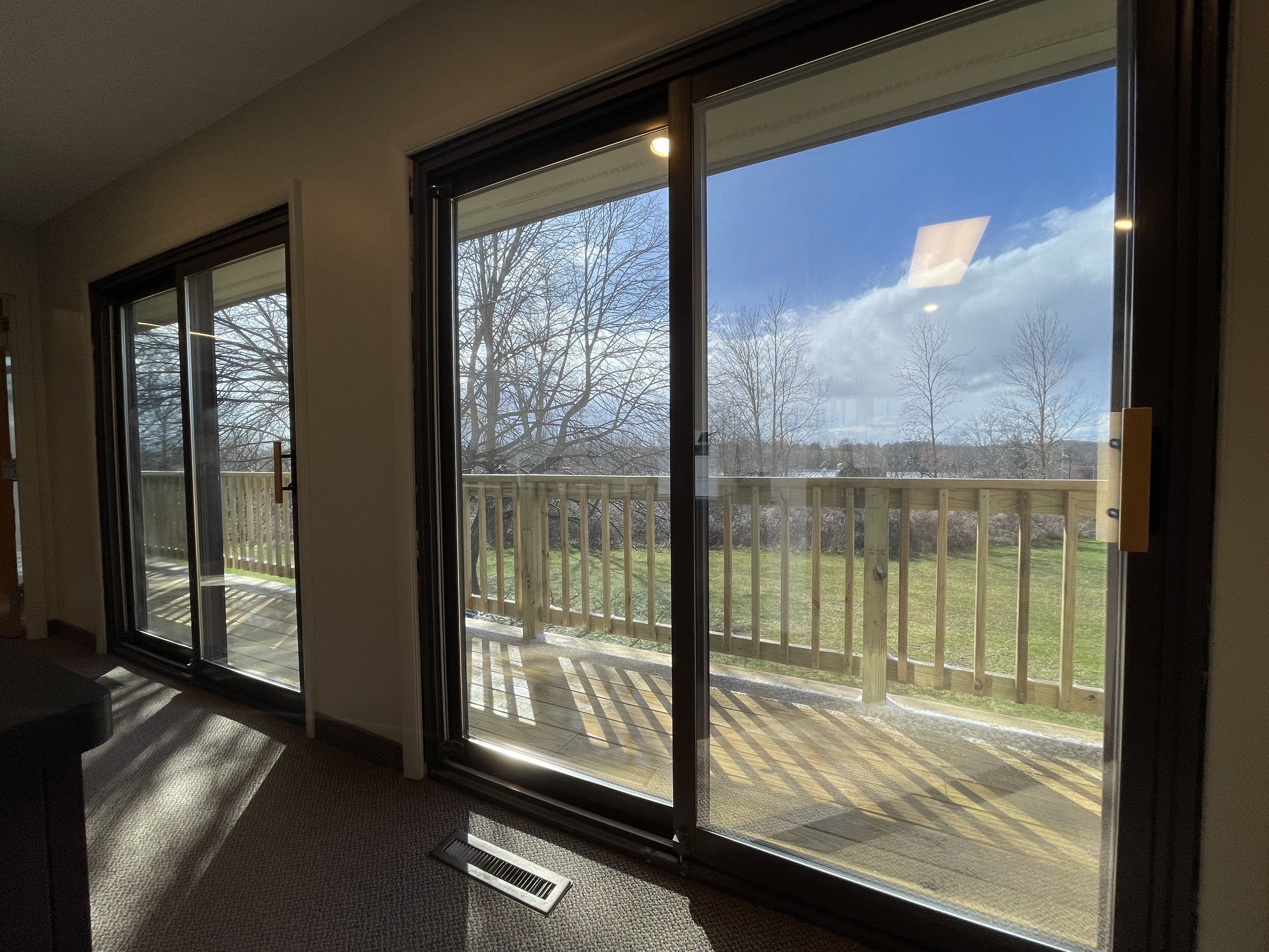 Modern room with glass doors overlooking deck